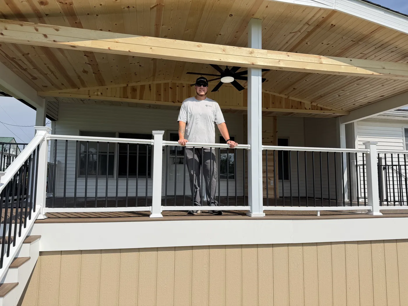 Nick from The Deck Company under a finished covered porch